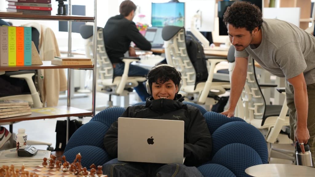 Two Gumloopers working through something together in the office lounge